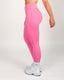 Person wearing bright pink leggings on a white background
