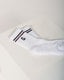 White socks with black stripes and a logo on a light gray background