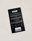 Back of a black product packaging with white text on a light gray background